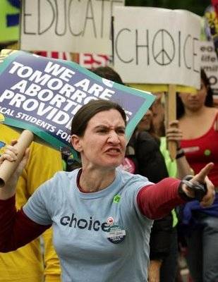 000Pro-Choice-activist-snarling-and-pointing-309x400